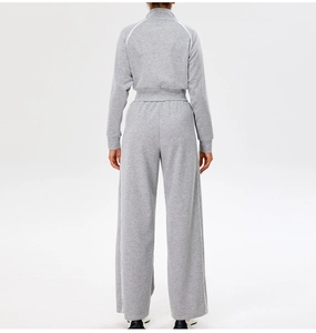 Rear view of grey athletic set with white stripes on stand collar jacket and wide leg pants