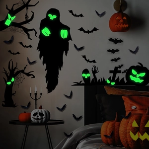 Luminous Halloween wall stickers featuring a glowing ghost, bats, and pumpkins in dark room