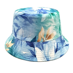 Detail of blue and green leaf print on canvas bucket hat with reinforced stitching
