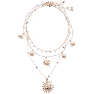 Three-layer gold necklace set with white pearls and sun-shaped pendants in bohemian style
