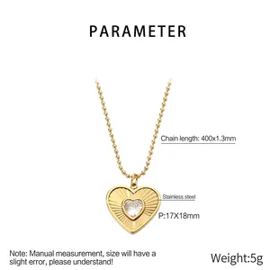 Detailed view of heart pendant with central zircon on beaded stainless steel chain