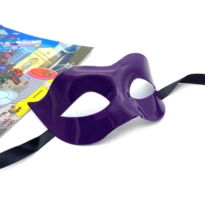 Detail of glossy purple half-face mask with black satin ribbon ties for masquerade