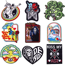 Detailed grid display of 9 diverse embroidered cartoon cat and astronaut patches