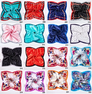 Collection of sixteen patterned satin square scarves featuring geometric and floral prints