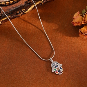 Silver Hamsa Hand pendant necklace with multi-colored crystals and sleek snake chain