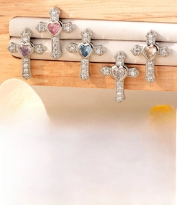 Detailed view of titanium steel cross earrings with colorful heart-shaped zircons
