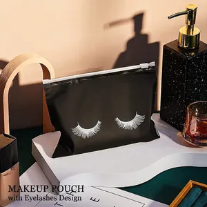 Frosted black EVA makeup bag with eyelash print on white wavy stand with decor