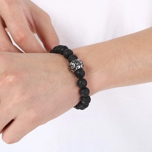 Natural black lava rock beaded bracelet for men featuring a vintage silver metal charm