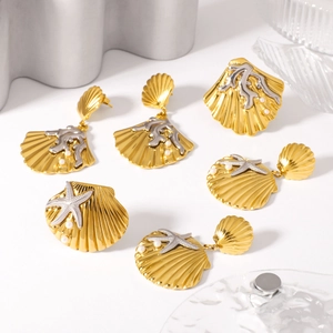 Golden starfish and coral jewelry set with pearls including earrings and rings