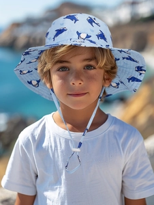 Detail of blue sun hat with shark print and adjustable chin strap for kids