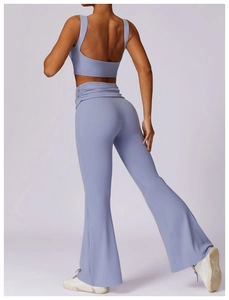 Detail of high-waist flared yoga pants and tank top set in light purple athletic fabric