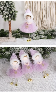 Detail of three purple Christmas angel ornaments with glitter mesh skirts and bells