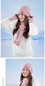 Detail of pink knitted winter set featuring ribbed texture beanie, scarf with tassels and gloves