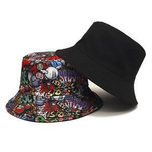 Reversible bucket hat with graffiti print and black canvas for outdoor sun protection