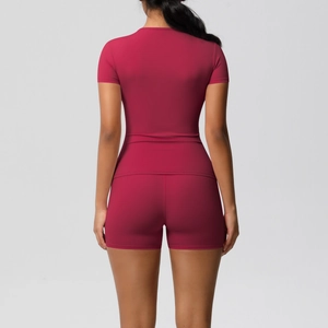 Back view of a slim-fit dark red yoga set featuring a short-sleeved top and tight shorts