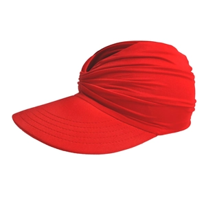 Detail of red turban style sun hat featuring twisted pleats and wide brim with stitching