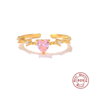 Close-up of S925 sterling silver ring with pink heart zircon and sparkling side stones