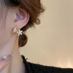 Elegant gold flower C-shaped earrings with clear zircon crystals for a stylish look