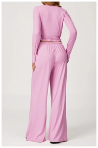 Back view of pink backless tie-up yoga top with high-waist wide-leg pants set