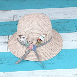 Detailed weave of kids pink straw sun hat with cute caterpillar and polka dot ribbon