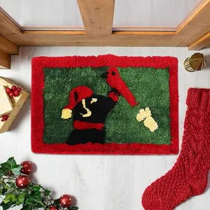 Detail of tufted Christmas rug featuring a black dog and cardinal on faux cashmere