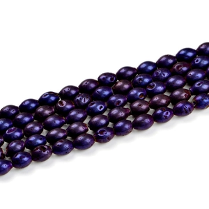 Detailed view of dark purple oval geode agate beads with metallic polished finish