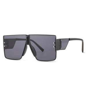 Oversized square shield sunglasses with black one-piece lens and carbon fiber texture