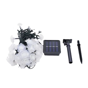 Solar powered white rose LED string lights with solar panel and garden stake for outdoor use