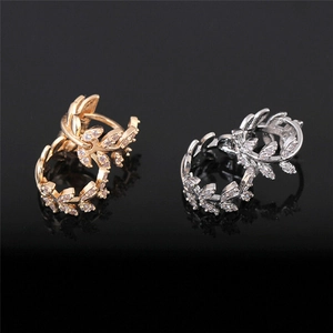 Fashionable branch leaf earrings with cubic zirconia available in gold and silver