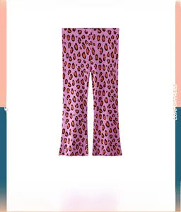 Detailed close-up of girls purple leopard print flared leggings with lettuce edge hem