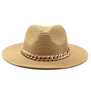 Detailed view of khaki straw fedora hat featuring a chunky gold metal chain decoration