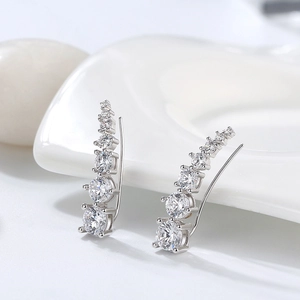 Macro shot of S925 silver ear crawlers with gradient cubic zirconia in prong setting