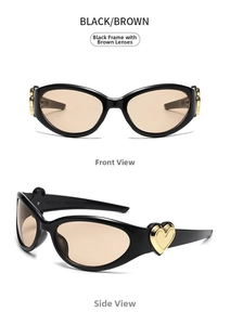 Macro view of vintage cat-eye sunglasses with gold heart detail on black plastic frame