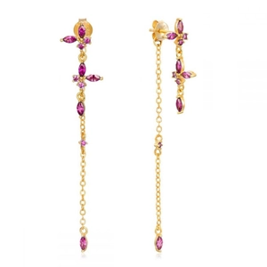 Detailed close-up of asymmetrical butterfly earrings with purple zircons and gold chain