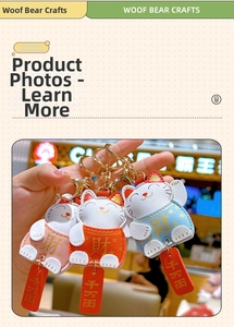 Detailed view of handmade leather Maneki-neko keychains in pink, orange and blue colors