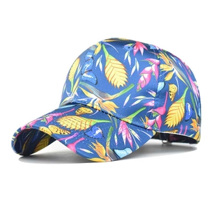 Blue tropical floral baseball cap with pink yellow flowers and butterfly prints