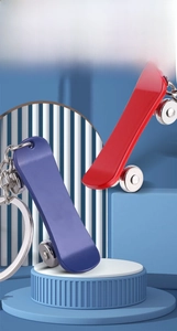 Detail of zinc alloy skateboard keychains with movable wheels and laser engraving option