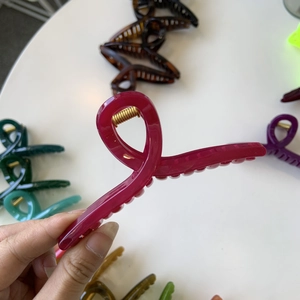 Detail view of large matte hair claw clip showing reinforced spring and durable teeth