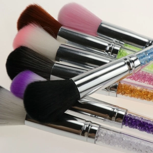 Colorful blush brushes with crystal-filled handles and vibrant soft synthetic bristles