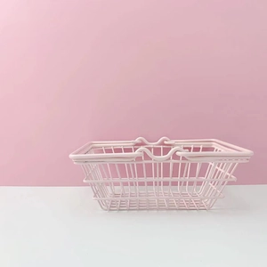 Pink metal mini storage basket with handles for capsule coffee and desktop organization