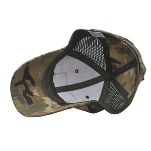 Macro detail of camouflage baseball cap interior with mesh and 65% polyester label