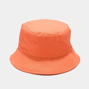 Close-up of bright orange cotton canvas fisherman hat showing detailed stitching and fabric texture