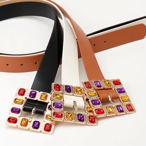 Fashionable leather belts with colorful gemstone buckles in black, white, and brown colors