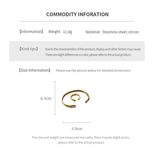 Detail view of gold stainless steel bangle with dimensions 6.4x4.9cm and 11.8g weight