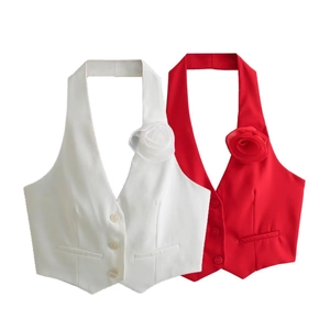 Detail of halter neck vest showing 3D rose flower accents and deep V-neck button closure