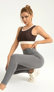 Detailed close-up of brown and white color-block high impact sports bra with wide straps