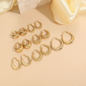 Collection of 14K gold plated hoop earrings in twisted and textured teardrop styles