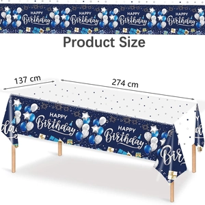 Detail of navy blue happy birthday tablecloth showing dimensions 274x137cm and festive patterns