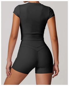 Rear view of black yoga set showing V-shaped back stitching for booty lifting effect