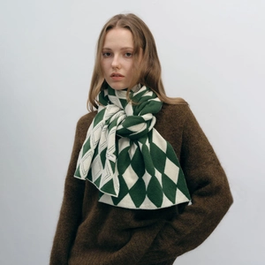 Chic green and white diamond knit scarf for winter warmth styled on a model